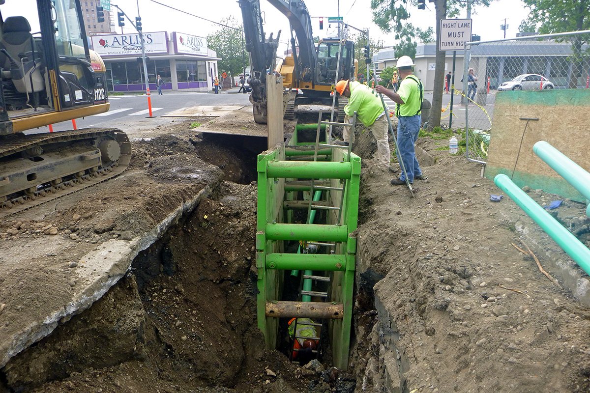 Group of people repairing the sewer line