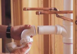 Plumber connecting PVC pipes